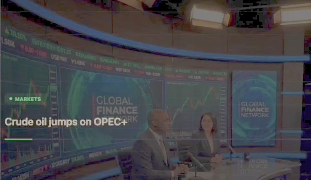 The Trading News Alerts studio desk mid-broadcast.